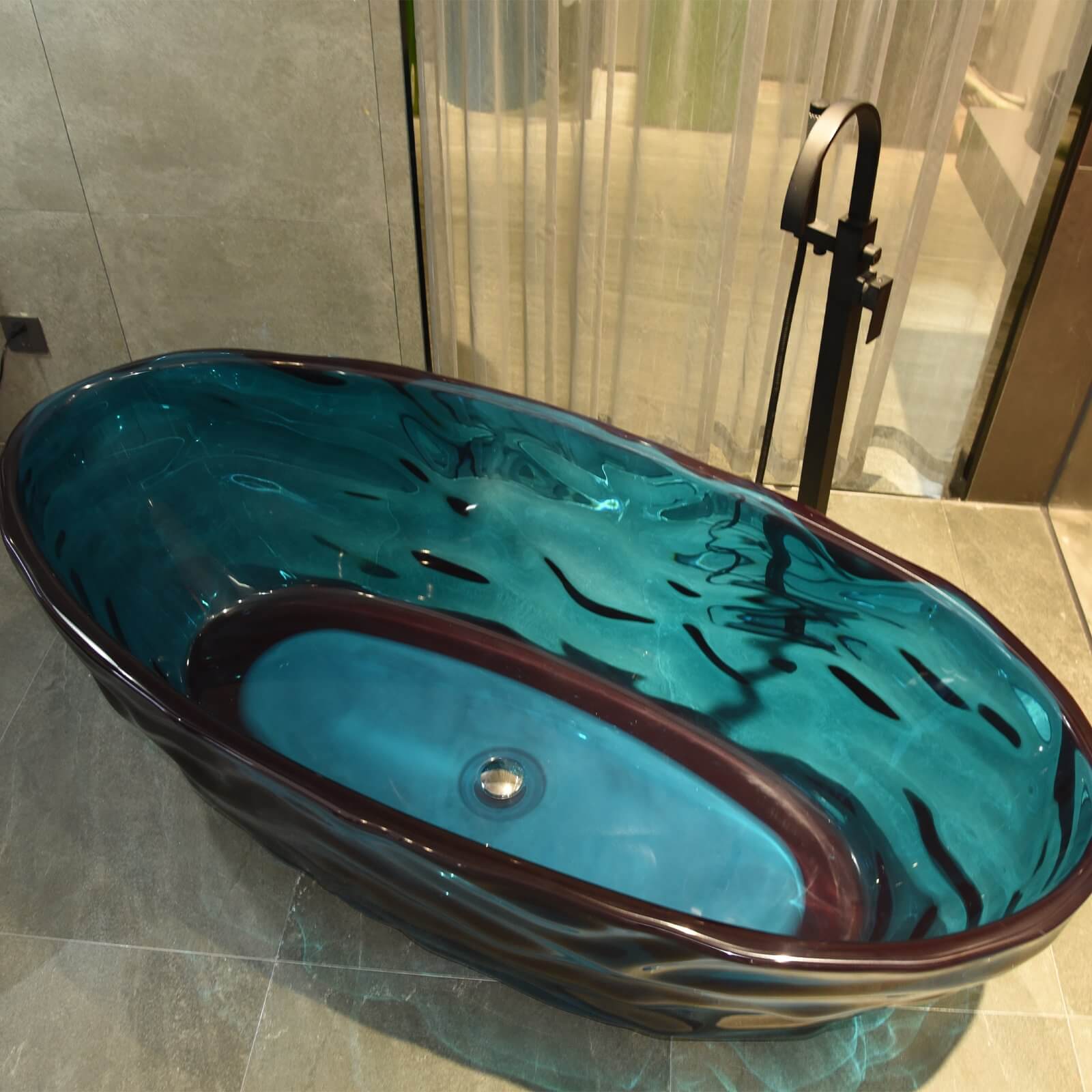 67 in blue transparent resin freestanding bathtub with wave design and sapphire like brilliance