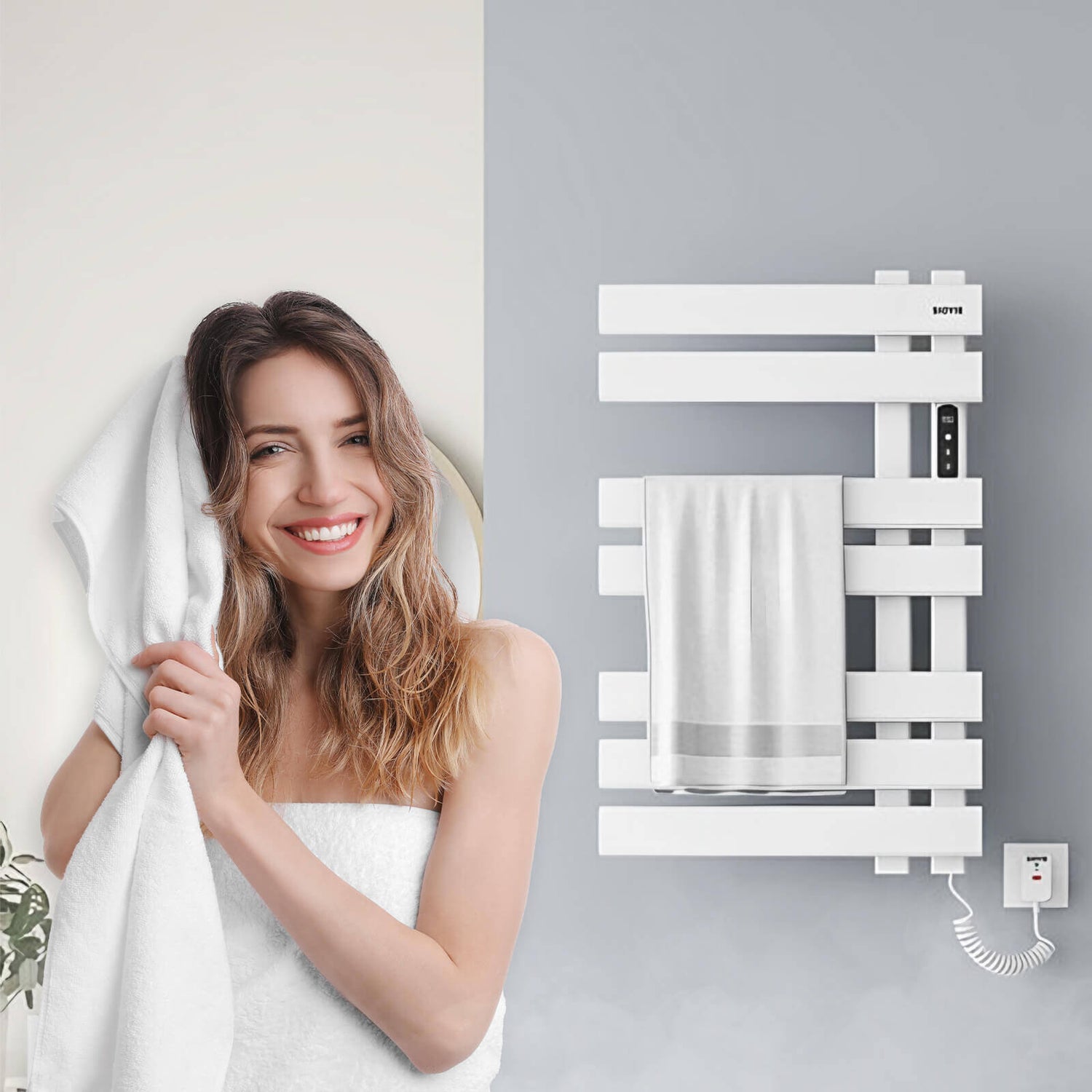 A girl uses a towel heater to heat a towel and then wipes her hair