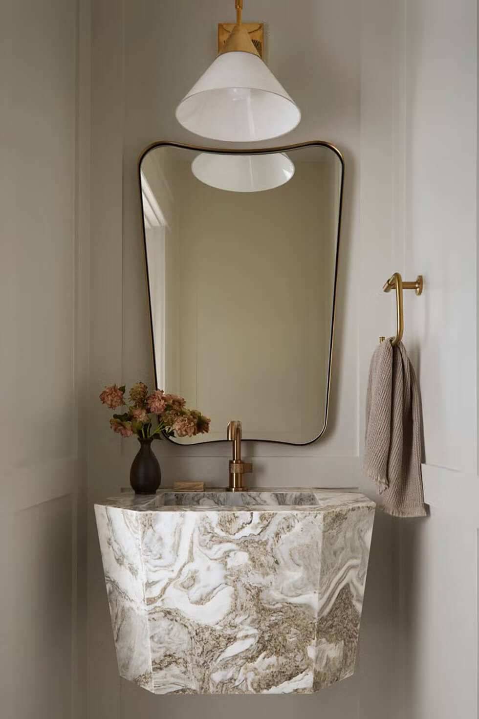 A quartz floating vanity installed in a small bathroom