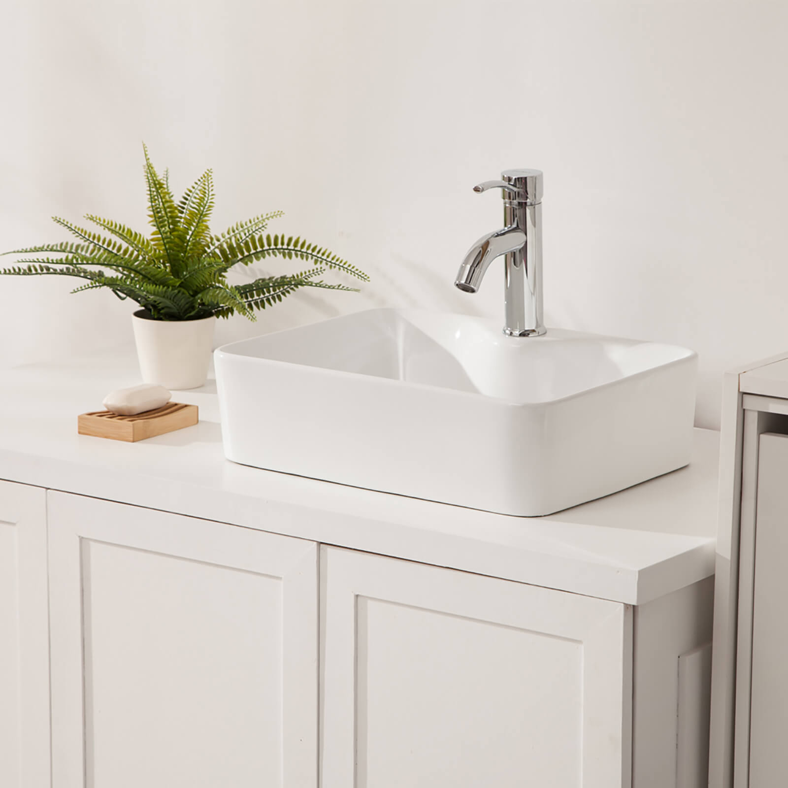 Above counter ceramic sink with sleek modern white design