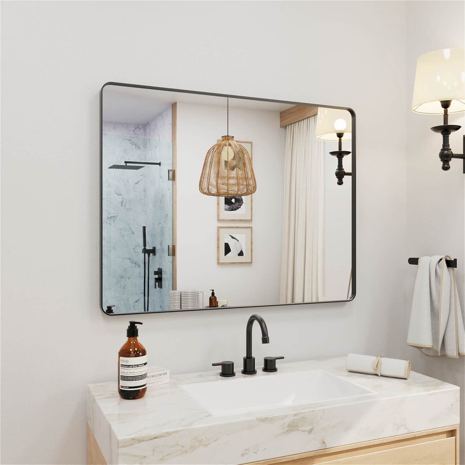 Angled mounted black framed rectangular vanity mirror