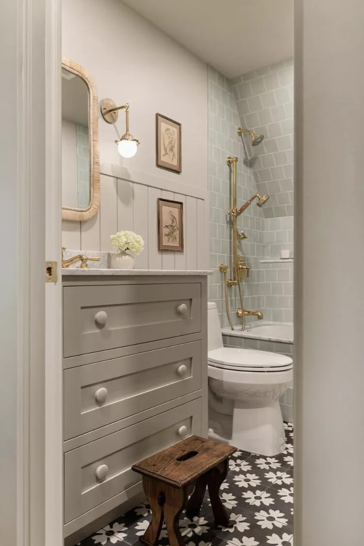 Beige cabinetry, paired with tone-on-tone hardware, brings a sense of calm and refinement to the bathroom