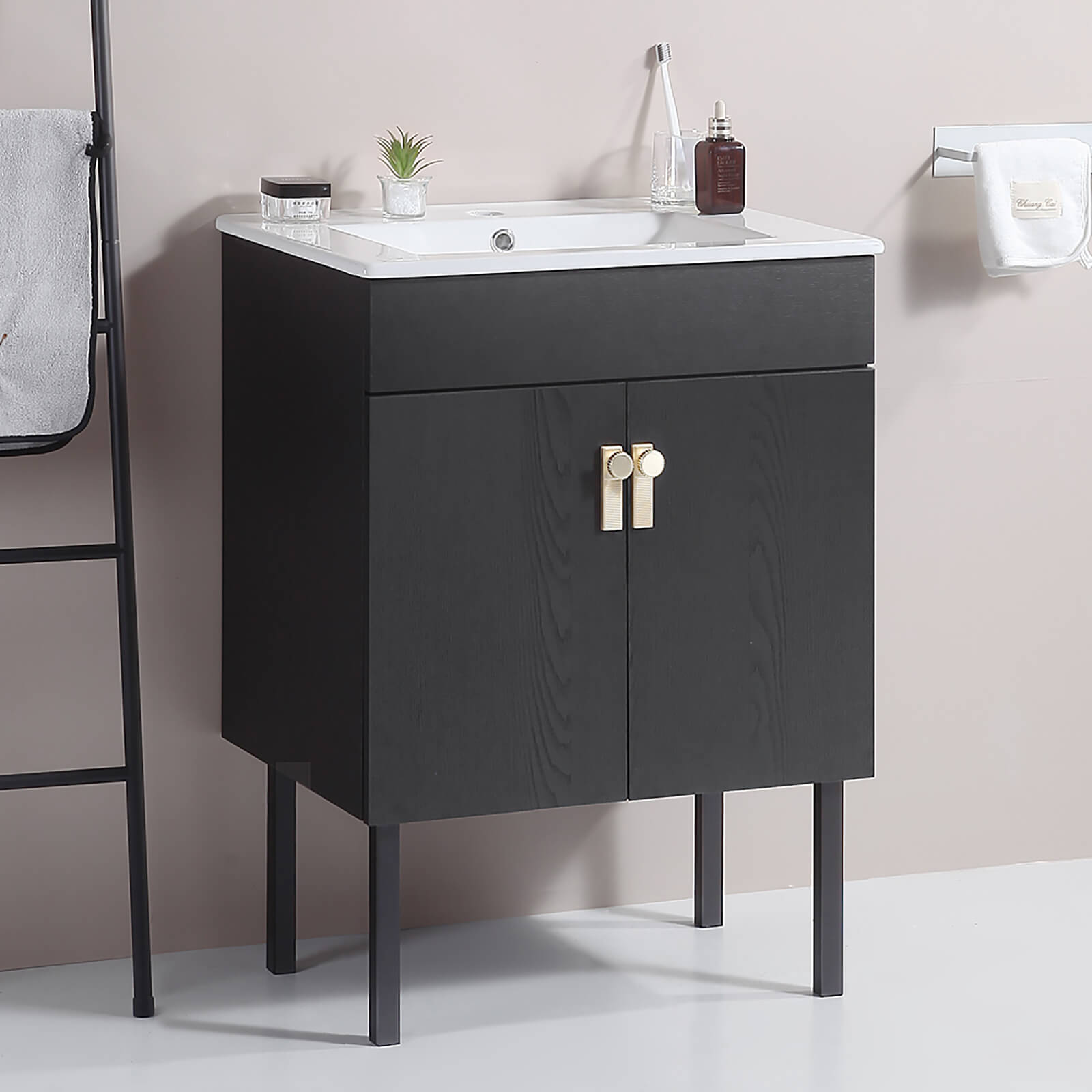 Black freestanding bathroom vanity with tall modern metal legs