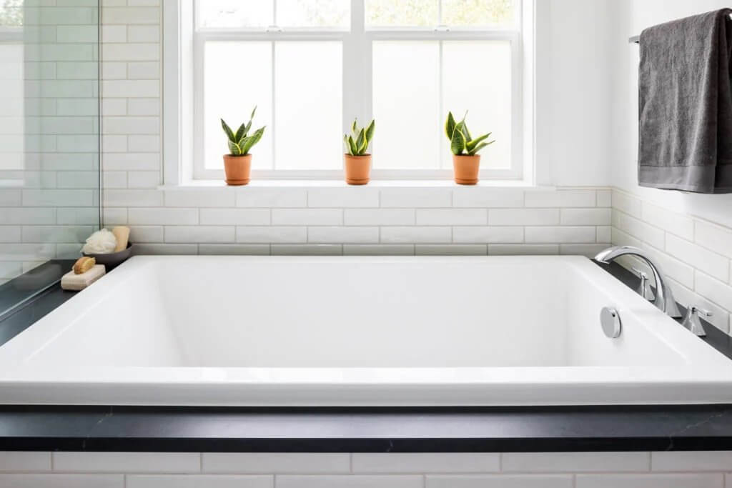 Combined shower and soaking tub