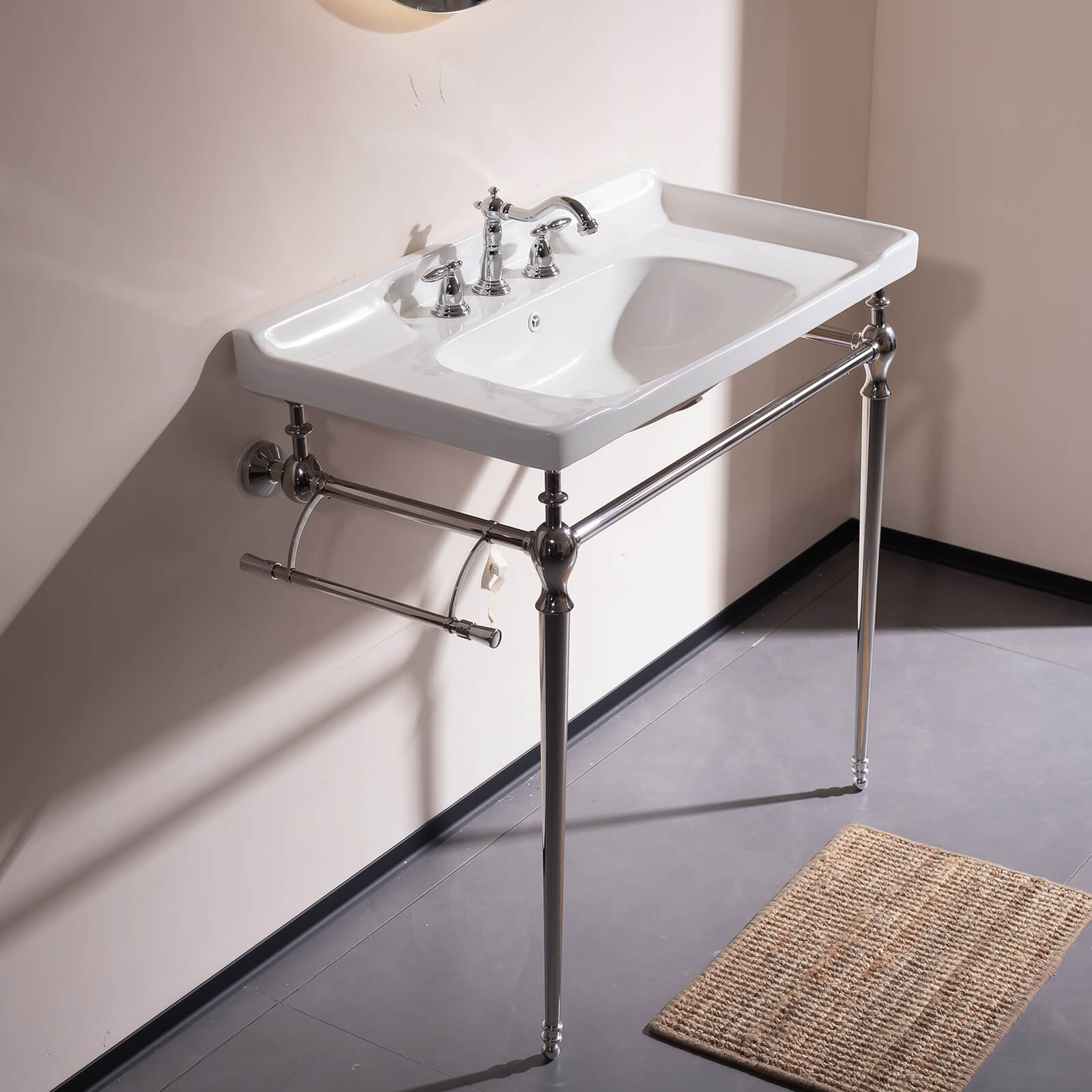 Console style bathroom sink with chrome legs and white ceramic basin timeless elegant look