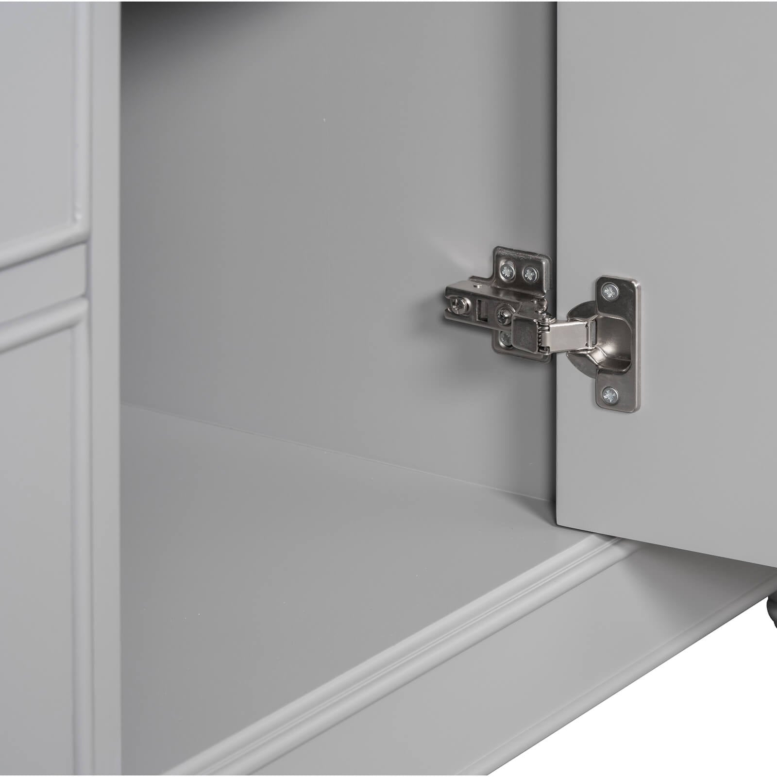 Detail of door opening of 36 inch grey bathroom vanity cabinet with hair dryer storage