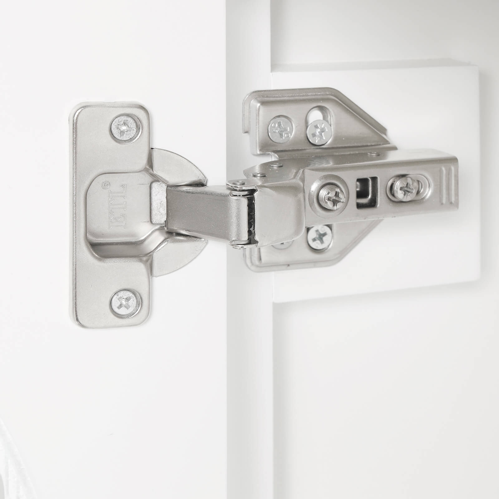 Detail of hinges on 20 inch white bathroom vanity with clear glass door