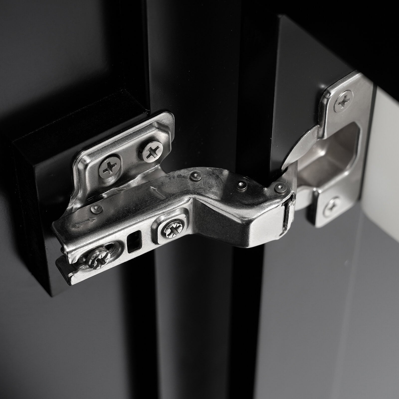 Detail of hinges on 30 inch modern black silk finish freestanding vanity