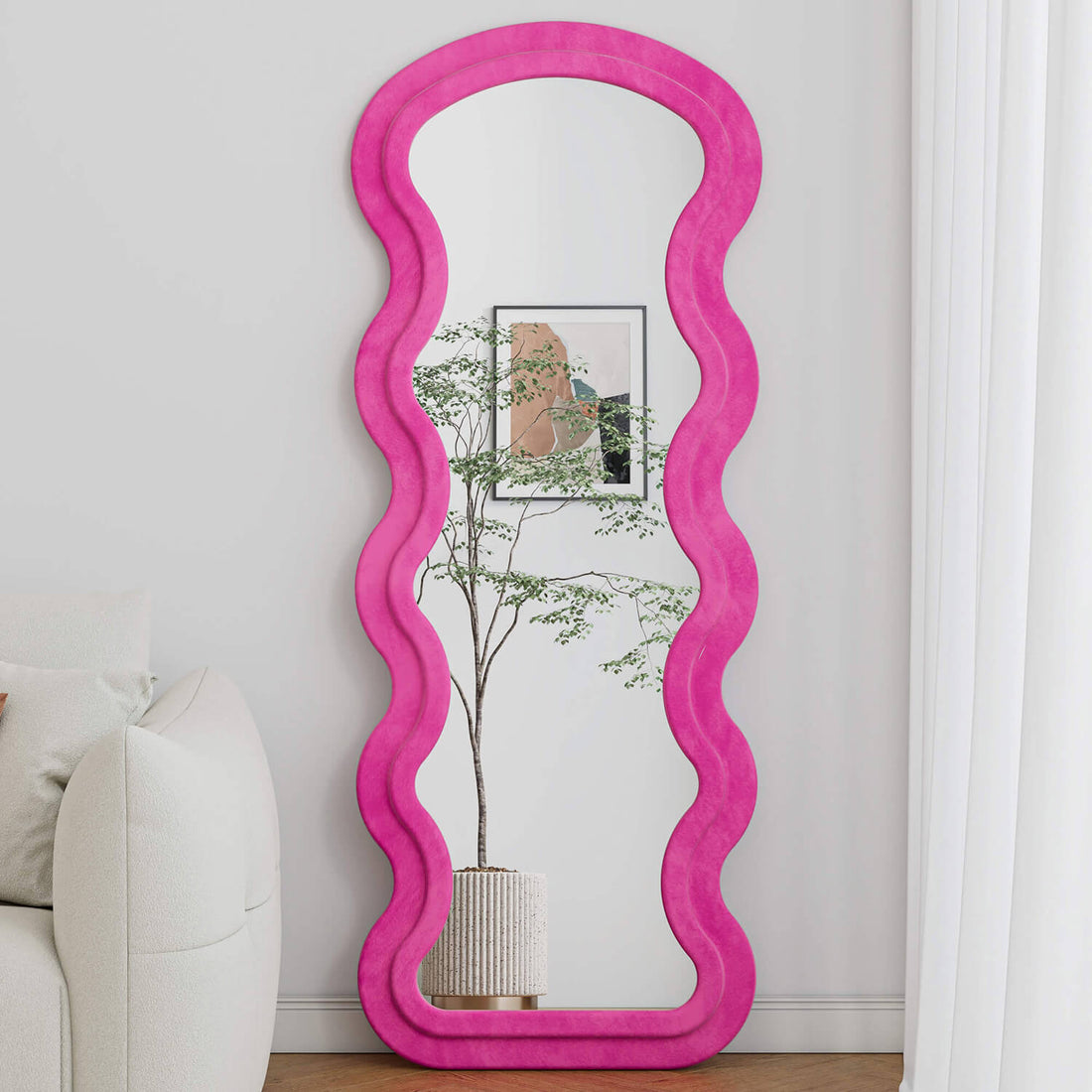 Freestanding pink wavy flannel mirror reflecting plant decor