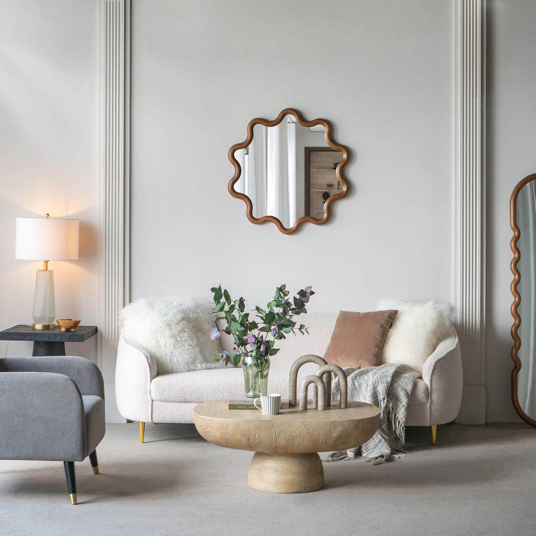 French vintage living room floral scalloped mirror above sofa