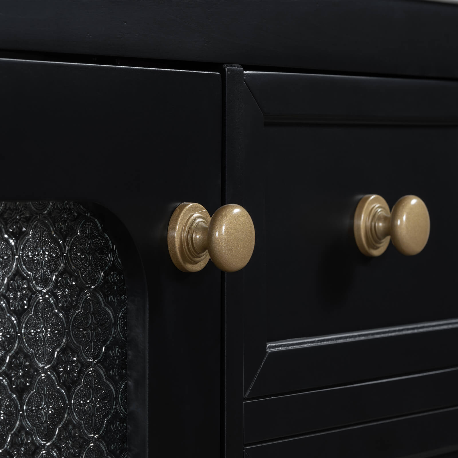 Gold handle detail on a 30 inch black bathroom vanity with frosted glass door