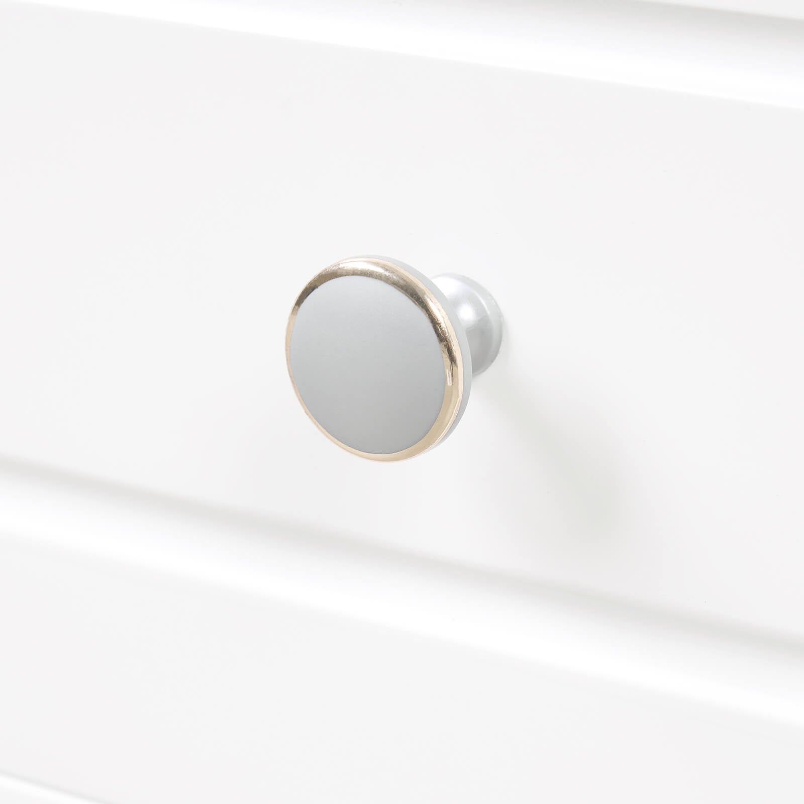 Handle detail of 20 inch white bathroom vanity with clear glass door