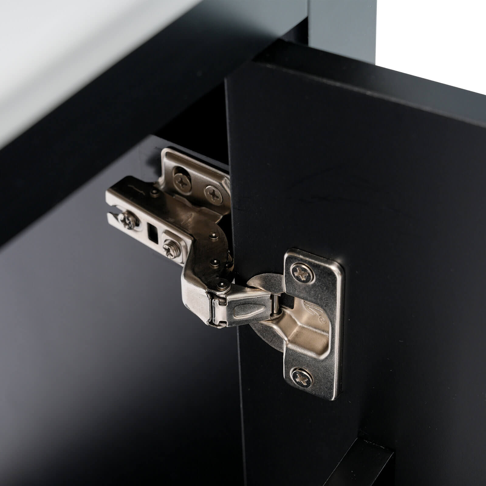 Hinge detail on a 20 inch black single door bathroom vanity