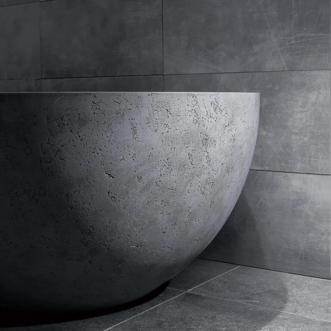 Industrial style solid surface bathtub in concrete tones