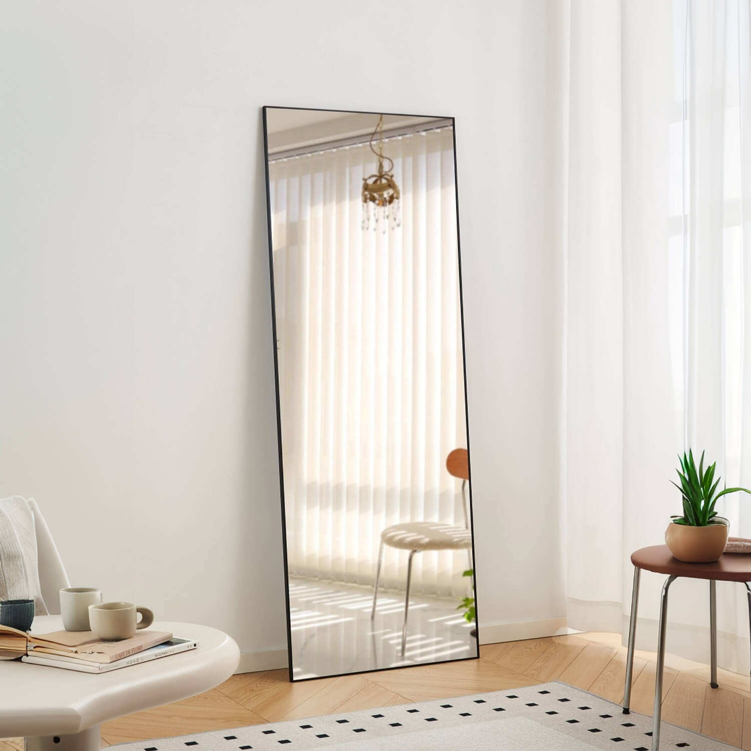 Leaning slim black framed full length mirror for bright modern space