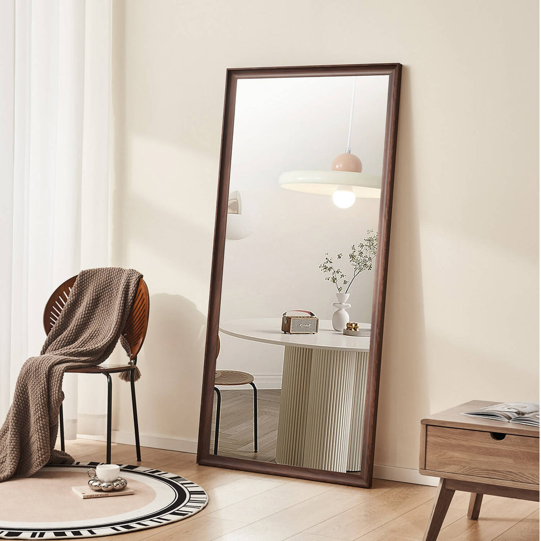 Leaning walnut framed full length mirror for cozy bedroom