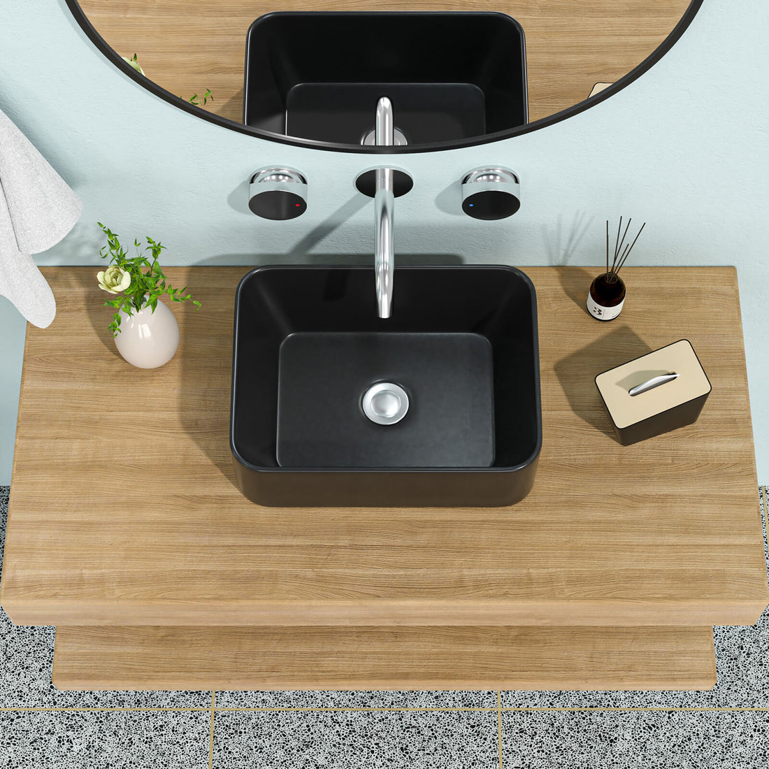 Matte black ceramic vessel sink with rounded rectangular design