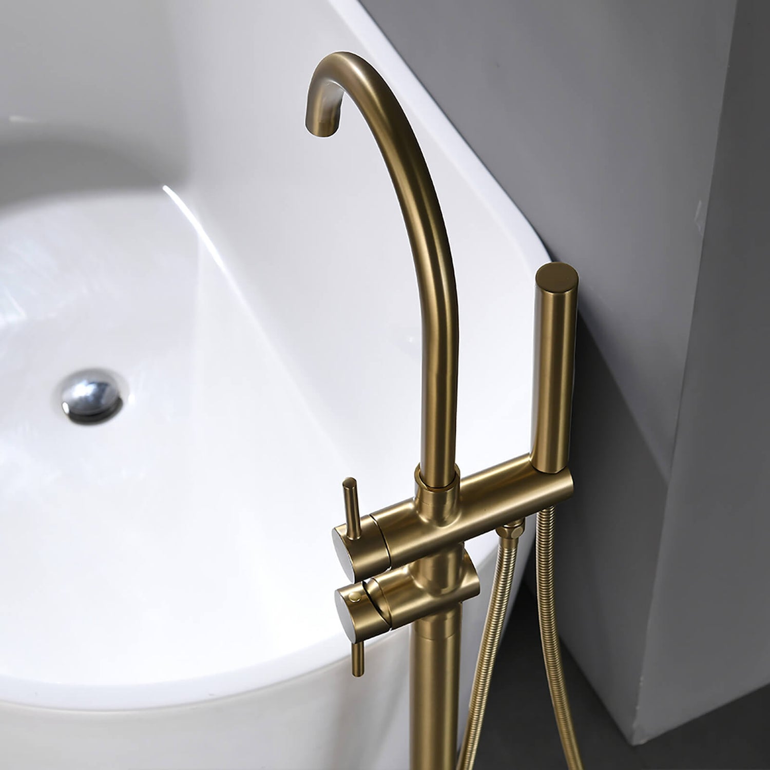 Modern brushed gold tub filler with swivel spout