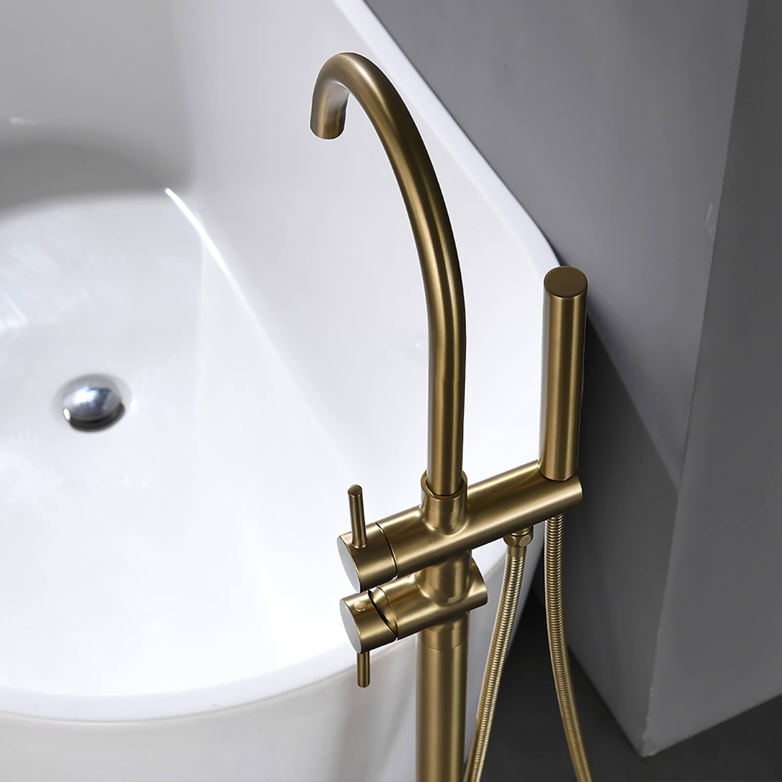 Modern brushed gold tub filler with swivel spout