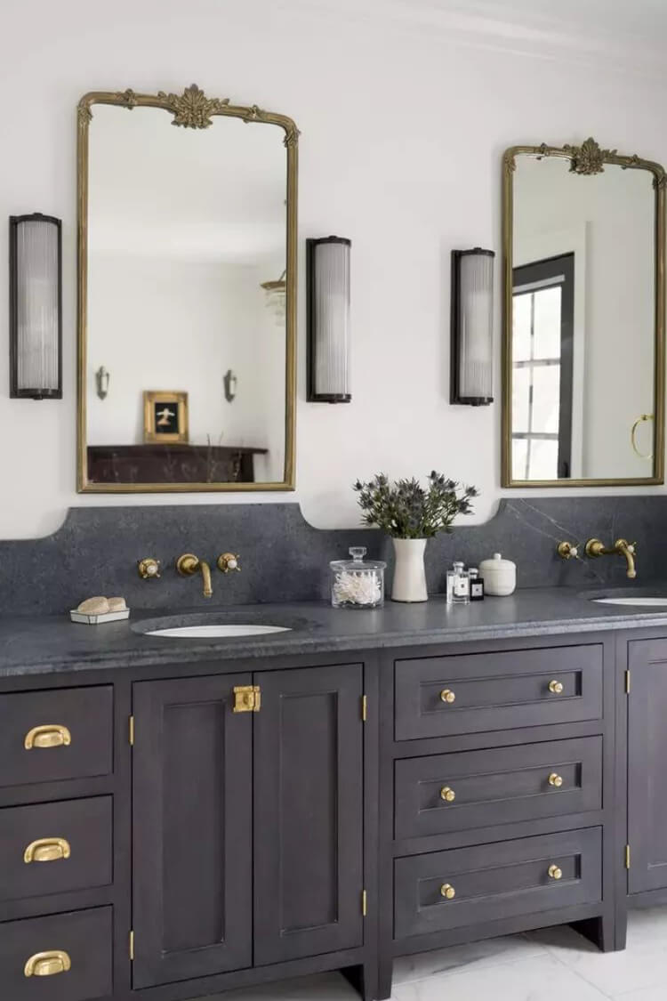 Paired with sleek black and gold accents, indigo cabinets create a bold, upscale look that’s both timeless and striking