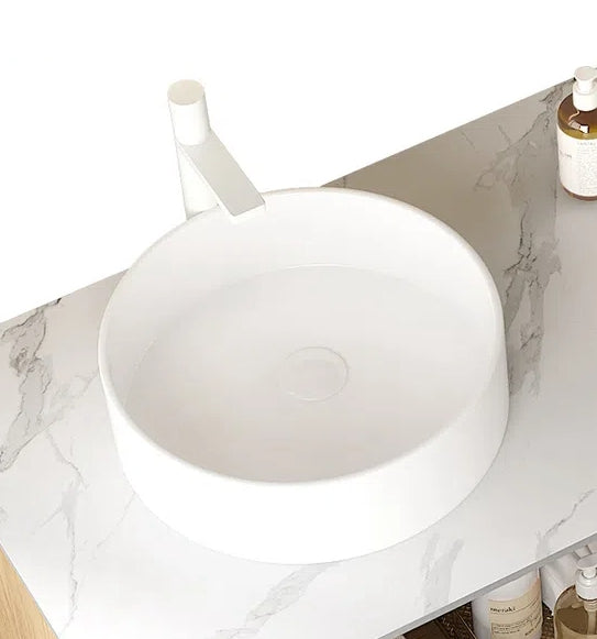 Round White Ceramic Above-Counter Vessel Bathroom Sink: One-piece ceramic design, above-counter installation, smooth finish