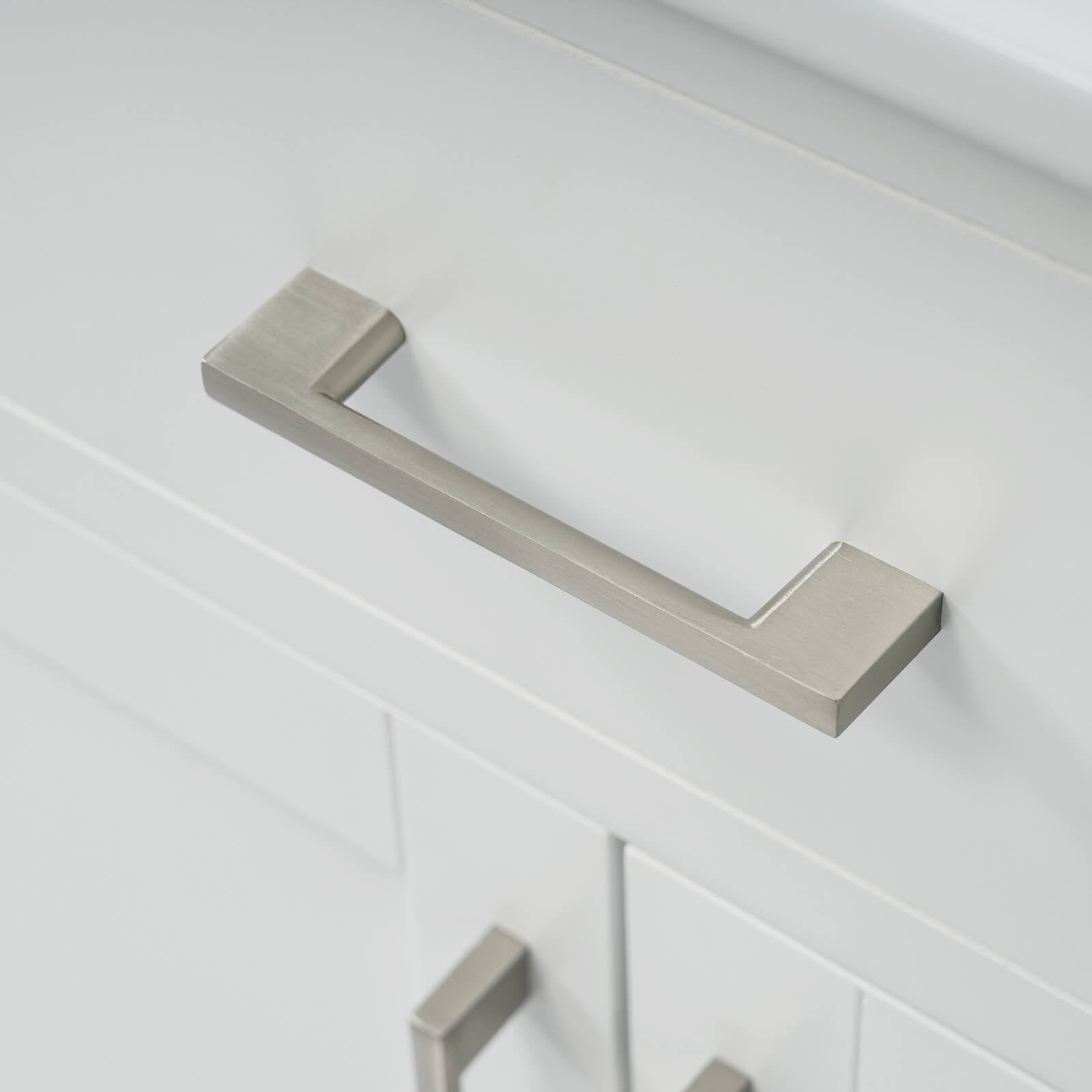 Silver handle detail on 30 inch modern white silk finish freestanding vanity