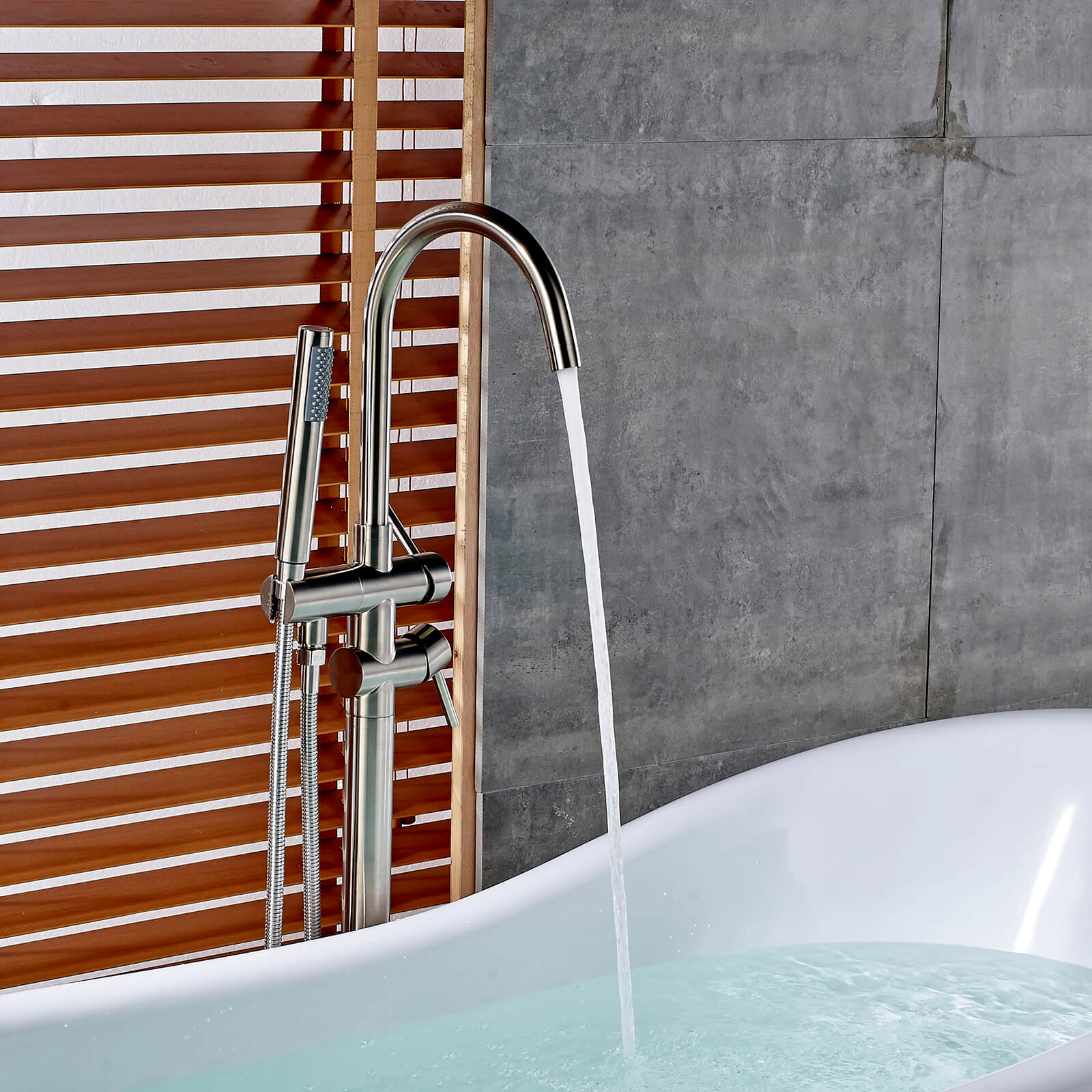 Sleek freestanding bathtub filler in brushed nickel finish