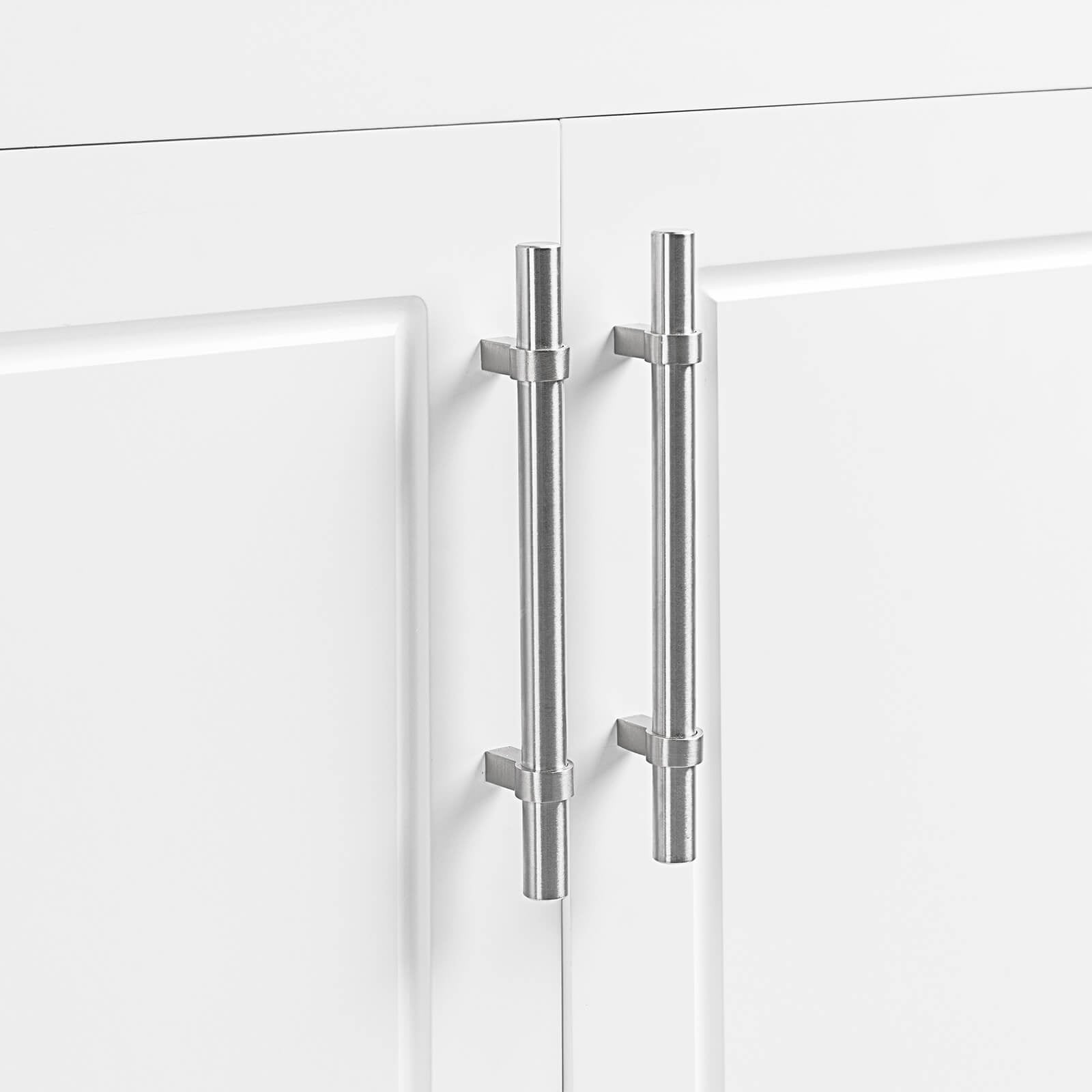 Stylish silver handles on sleek white bathroom cabinet