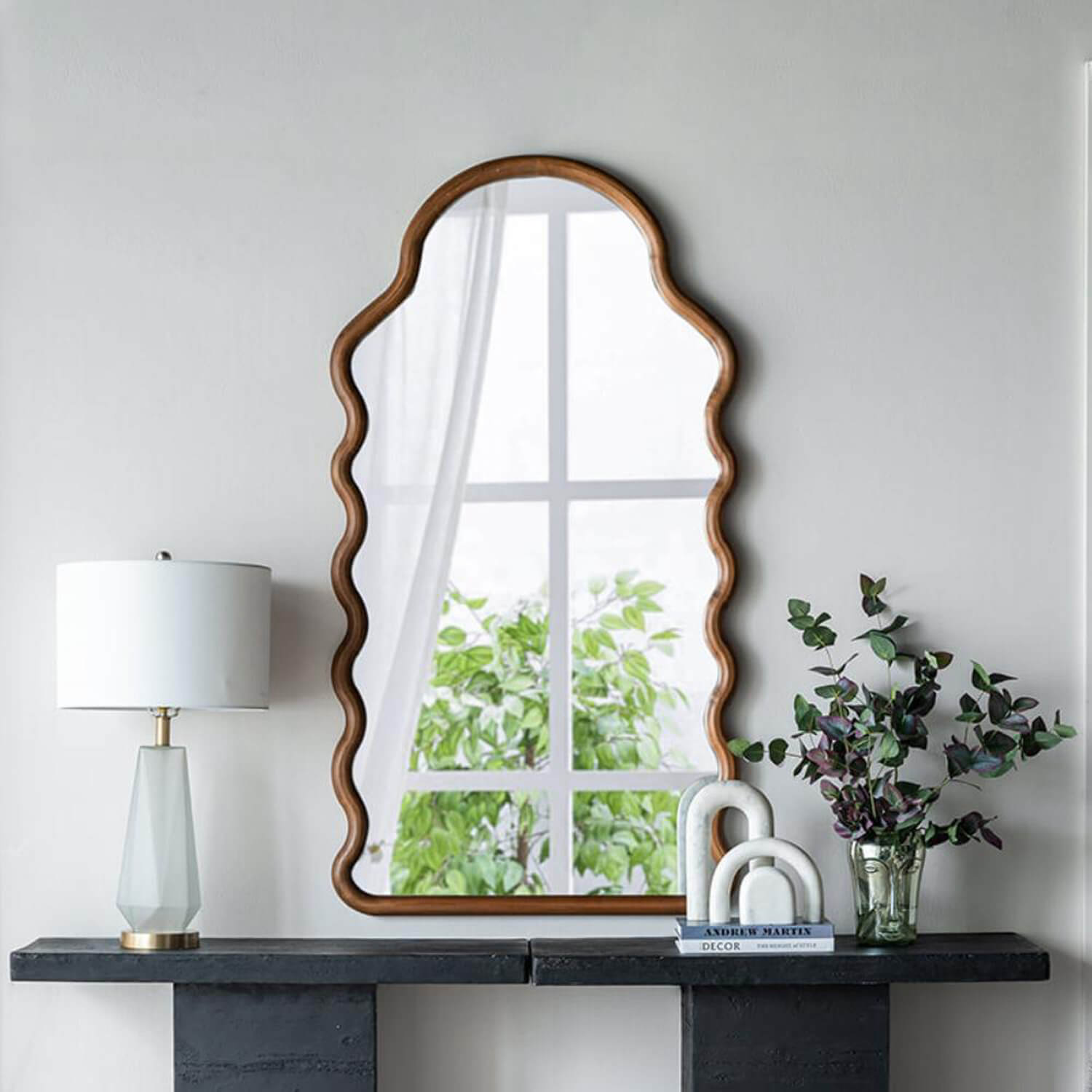 Wall mounted scalloped mirror for modern entryway with table decor