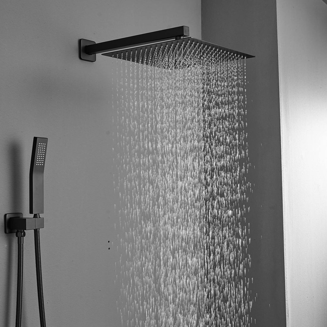 Water spraying from matte black rainfall shower head