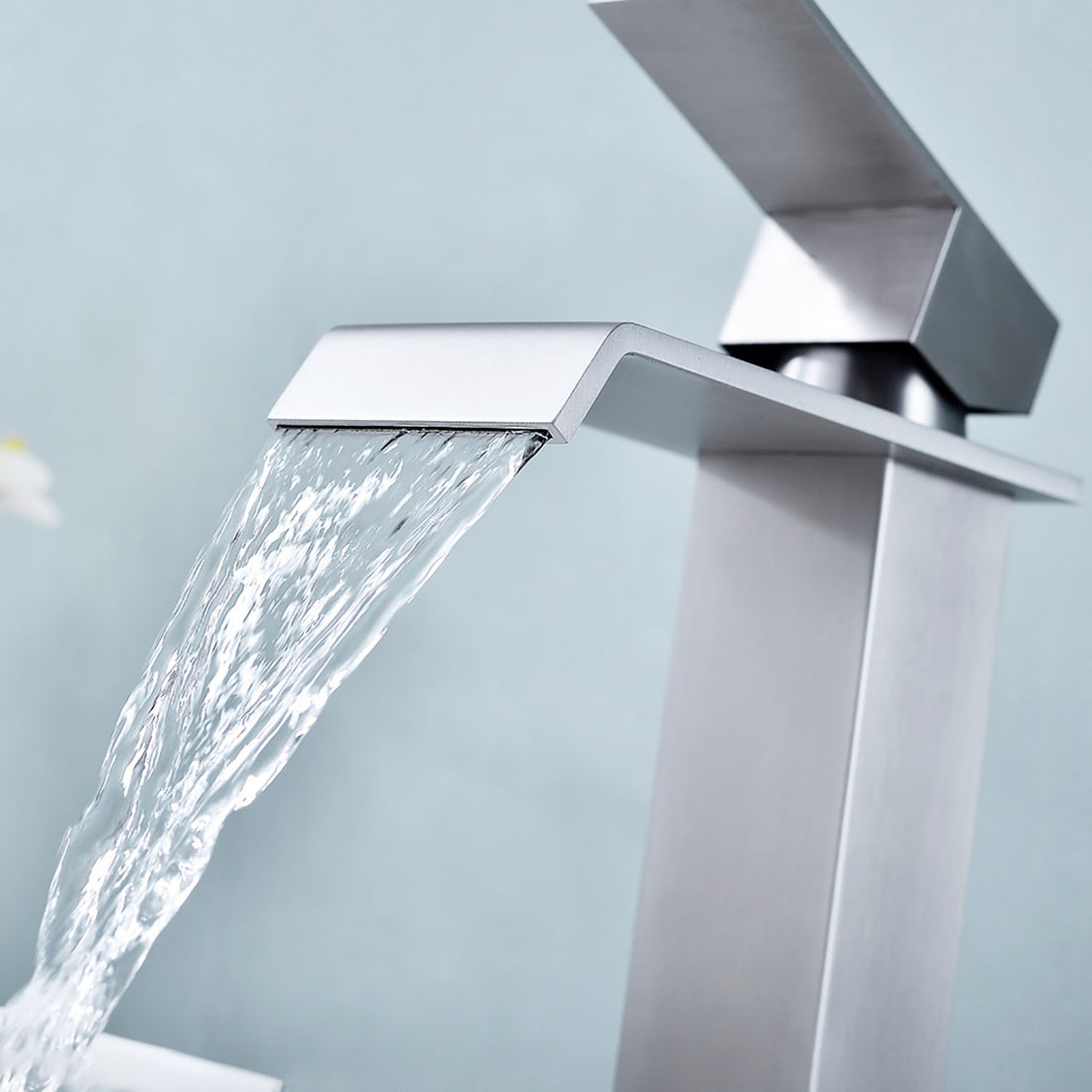 Waterfall flow from Brushed Nickel Single Handle Bathroom Faucet