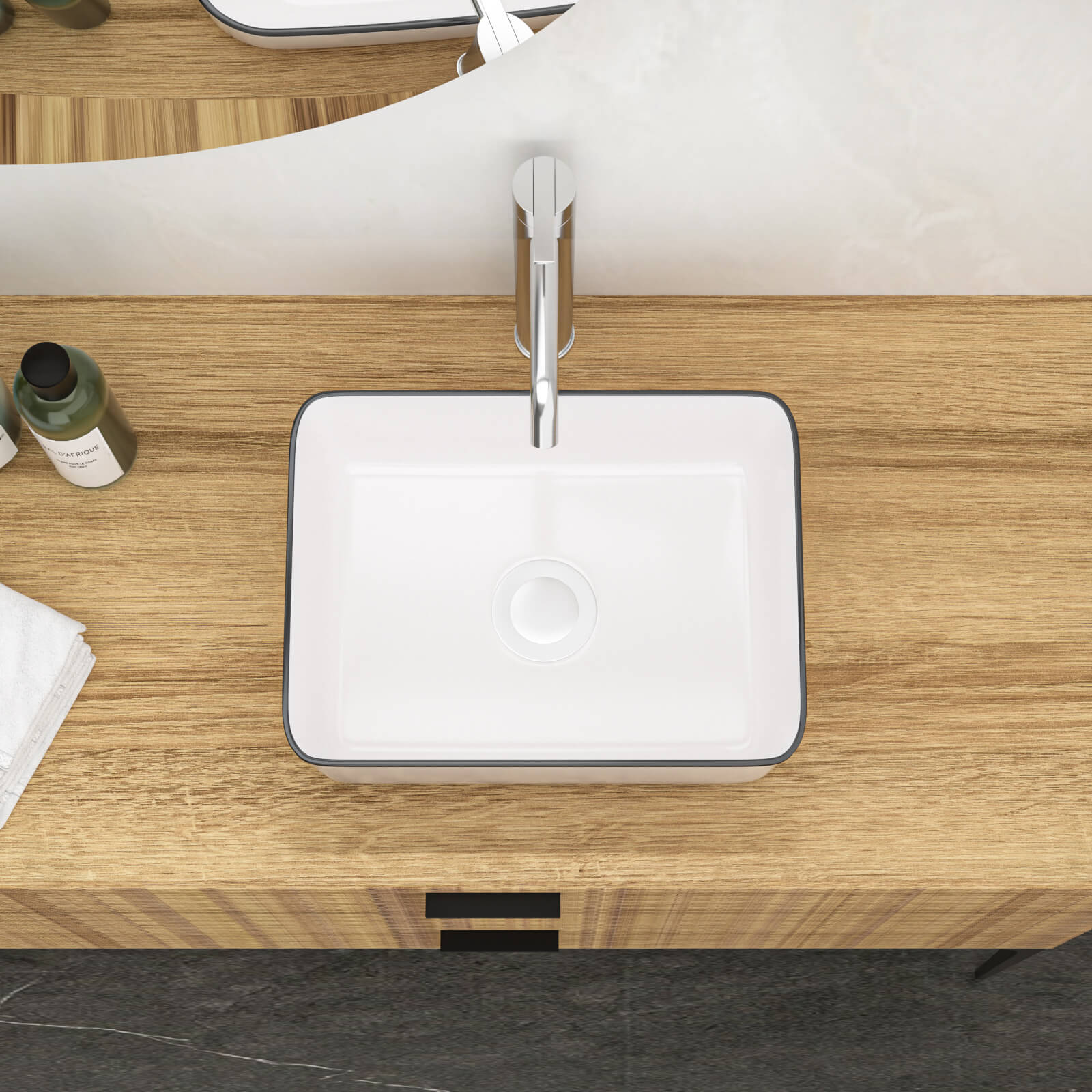 White ceramic bathroom sink with bold black trim border