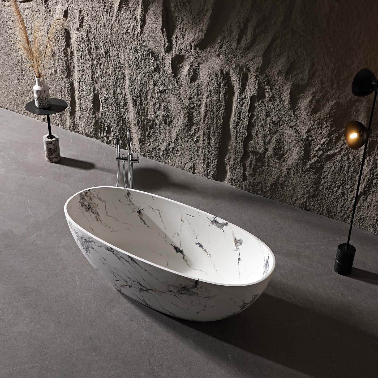 luxury oval bathtub with black and white marble veins