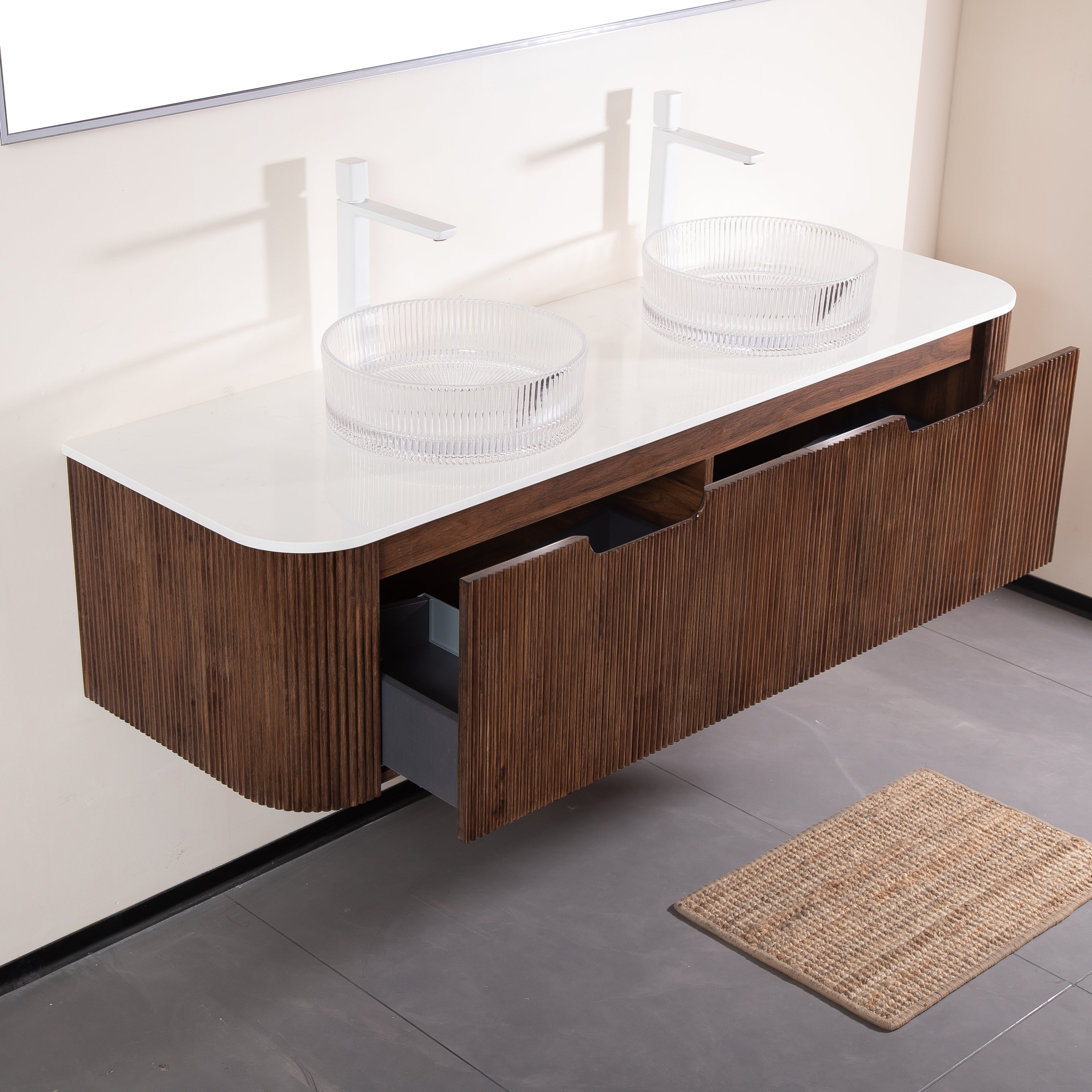 modern bathroom vanity with clear vessel sinks and storage drawers
