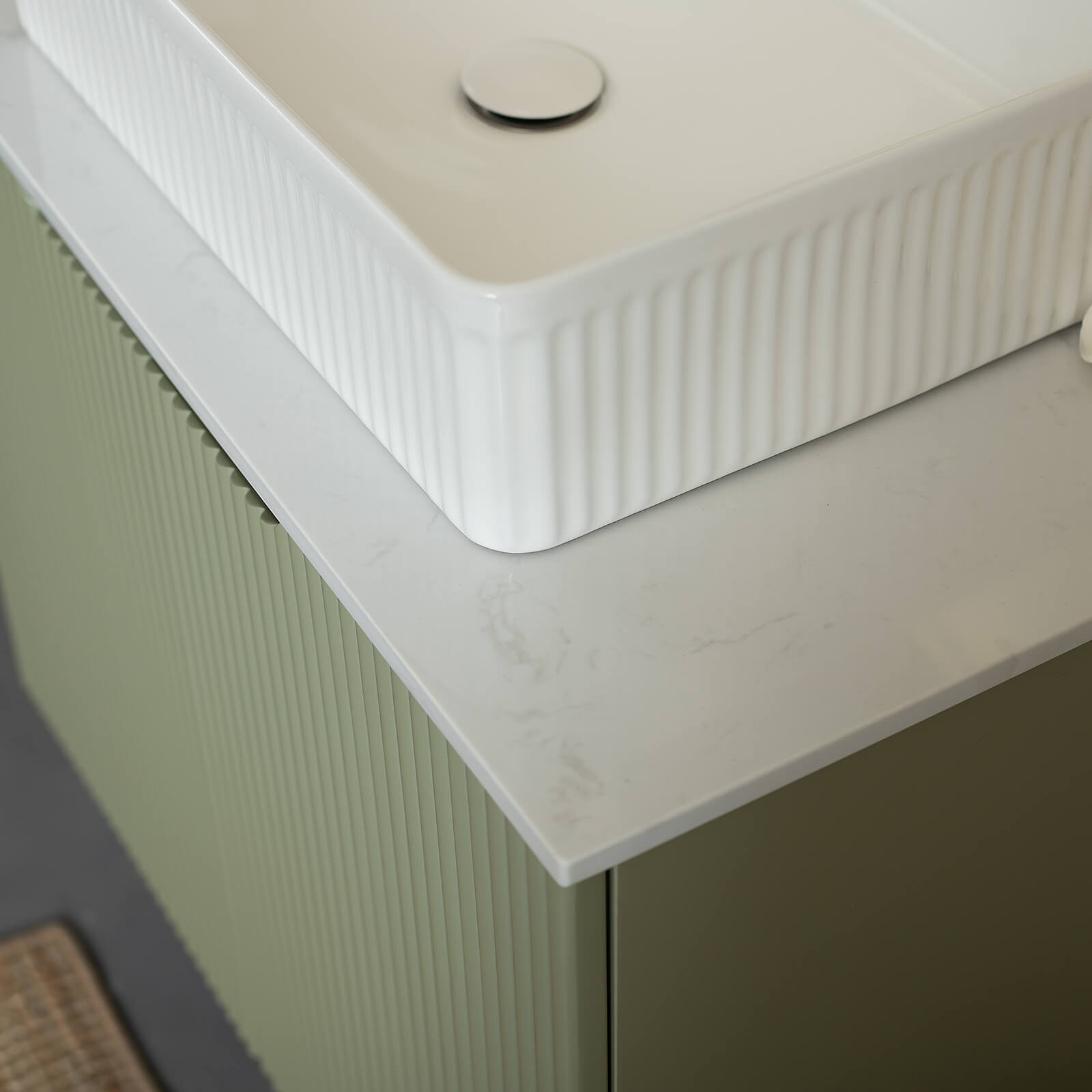 modern green bathroom vanity with sintered stone top