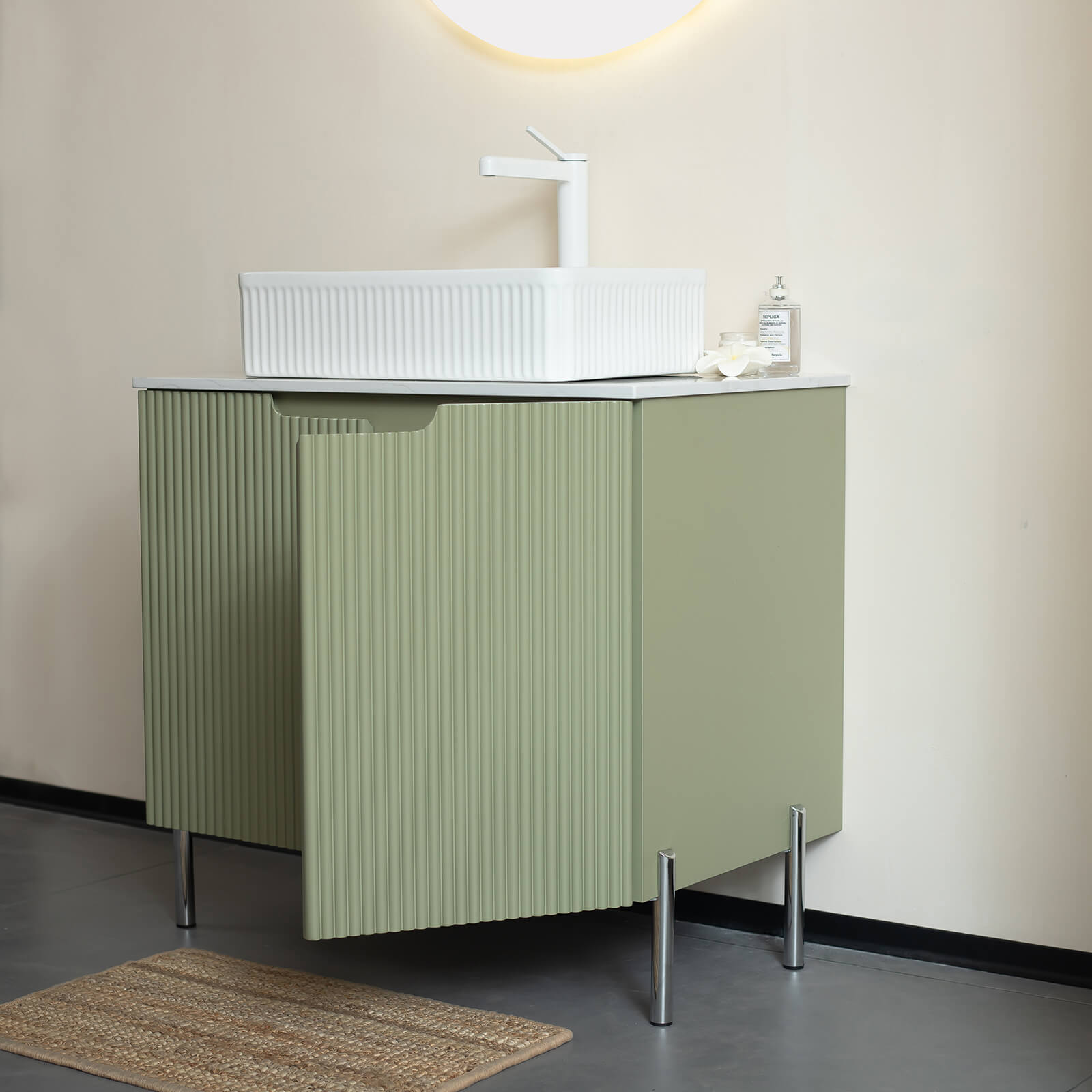 soft sage green vanity with fluted cabinet doors