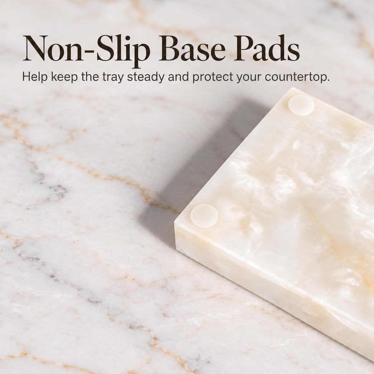 Non-slip base pads on a white jade marble vanity tray for bathroom countertop protection