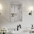 16 x 24-inch mirrored medicine cabinet above a sink on a white marble wall.