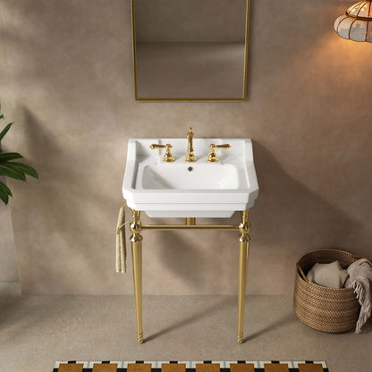 Front bathroom view of a 23-inch white ceramic console sink with gold legs and a side towel bar beneath a rectangular mirror.