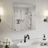 24 x 26-inch mirrored medicine cabinet above a sink on a white marble wall.