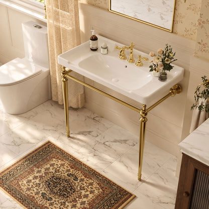 Fregadero de consola de cerámica blanca de 91 cm con patas de metal dorado.