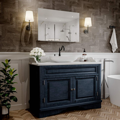 36 x 24-inch mirrored medicine cabinet above a blue bathroom vanity.