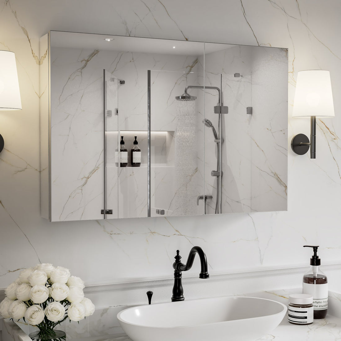 36 x 24-inch mirrored medicine cabinet above a sink on a white marble wall.