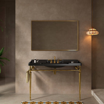 Front view of a 48-inch black ceramic console sink with gold legs and a towel bar beneath a rectangular mirror.