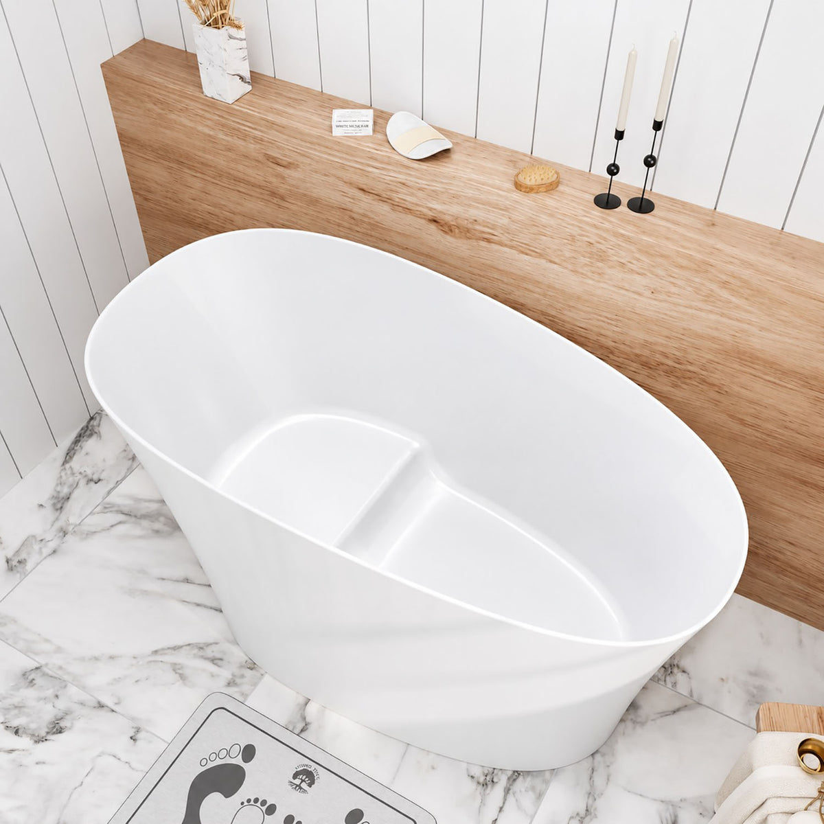 Bañera japonesa independiente de 51" con forma de zapatilla individual, superficie sólida de resina de piedra y asiento incorporado.