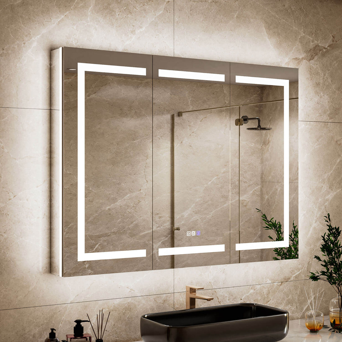 Close-up bathroom view of a 54 x 36-inch triple-door LED medicine cabinet with mirror with illuminated mirror edges above a black vessel sink.