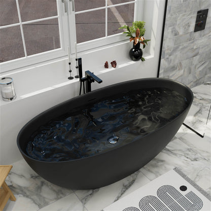 61-inch black stone resin soaking bathtub filled with water