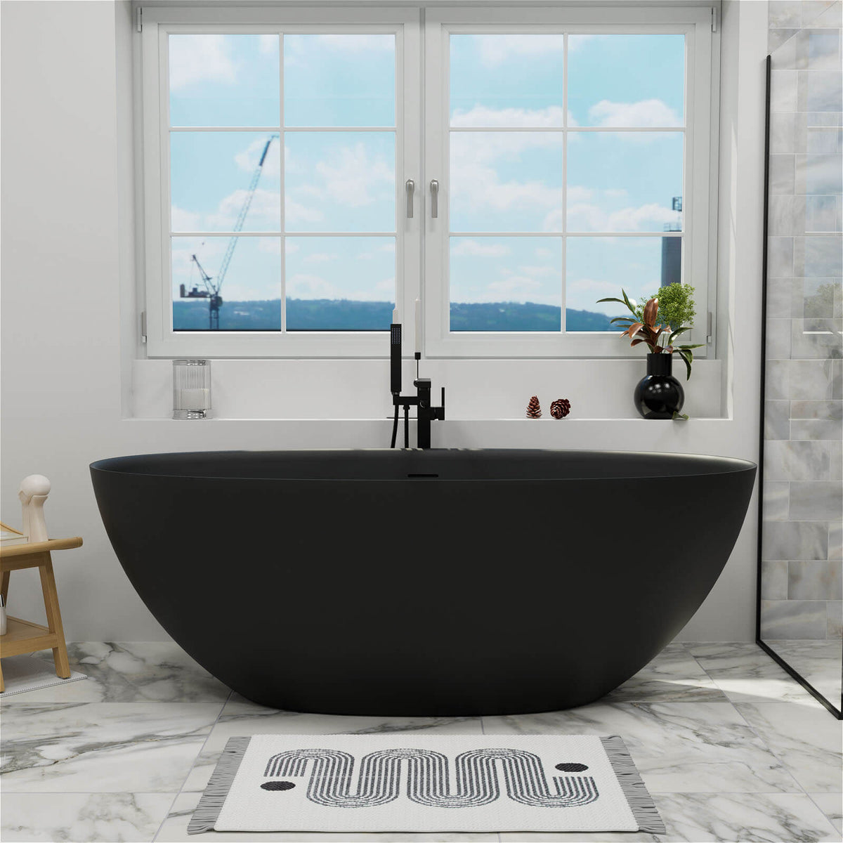 61-inch black stone resin freestanding tub below a window