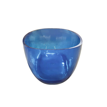 End view of a transparent blue resin freestanding bathtub showing its curved sides on a white background.
