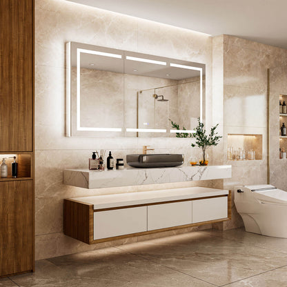 Angled bathroom view of a 72 x 36-inch triple-door LED medicine cabinet with mirror above a floating vanity beside a bathtub.